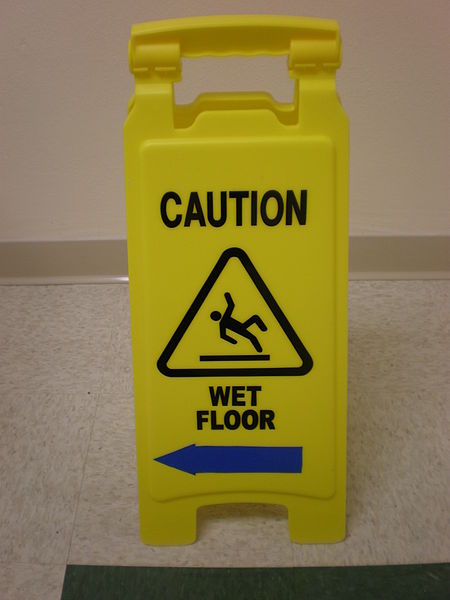 450px-Yellow wet floor caution sign in English